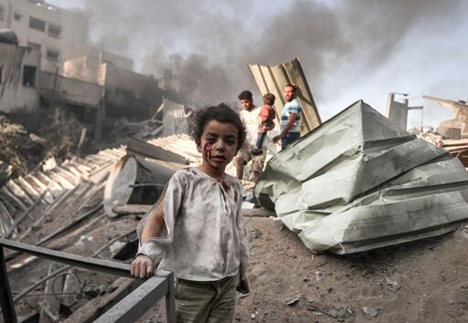 stock image of a Palestinian child at the site of an Israeli bombing